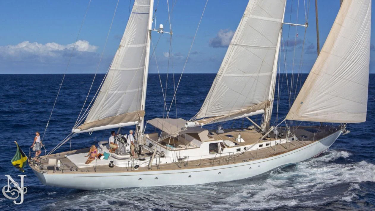 a group of people sailing on a sailboat aboard WISDOM Yacht for Sale