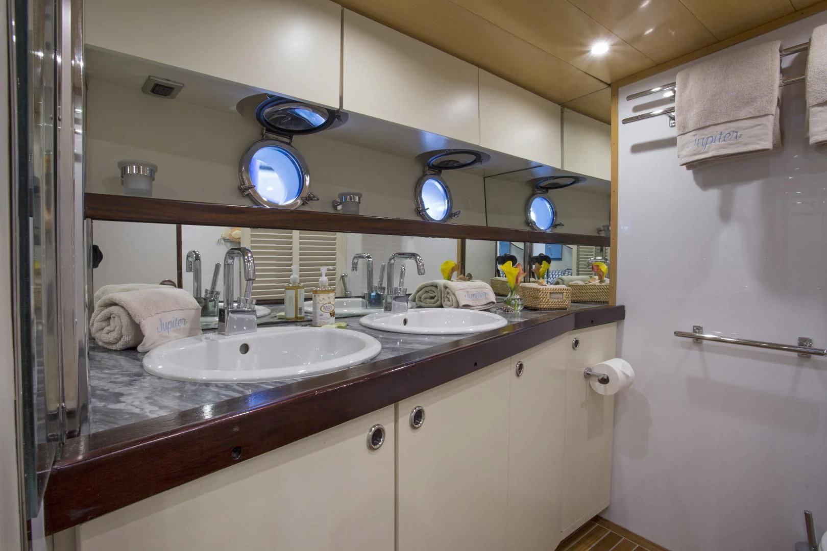 a bathroom with a large mirror aboard WISDOM Yacht for Sale