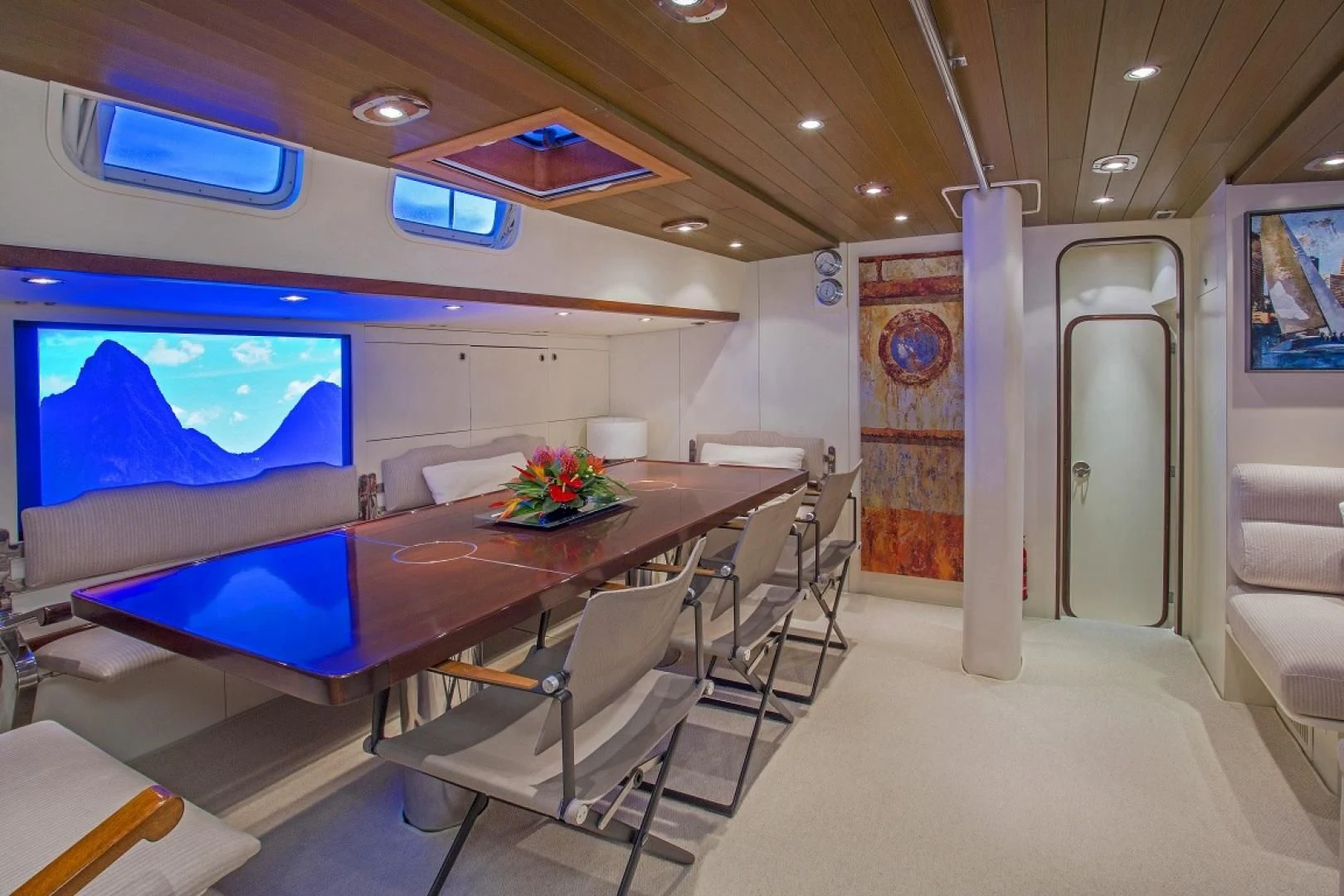 a room with a table and chairs aboard WISDOM Yacht for Sale