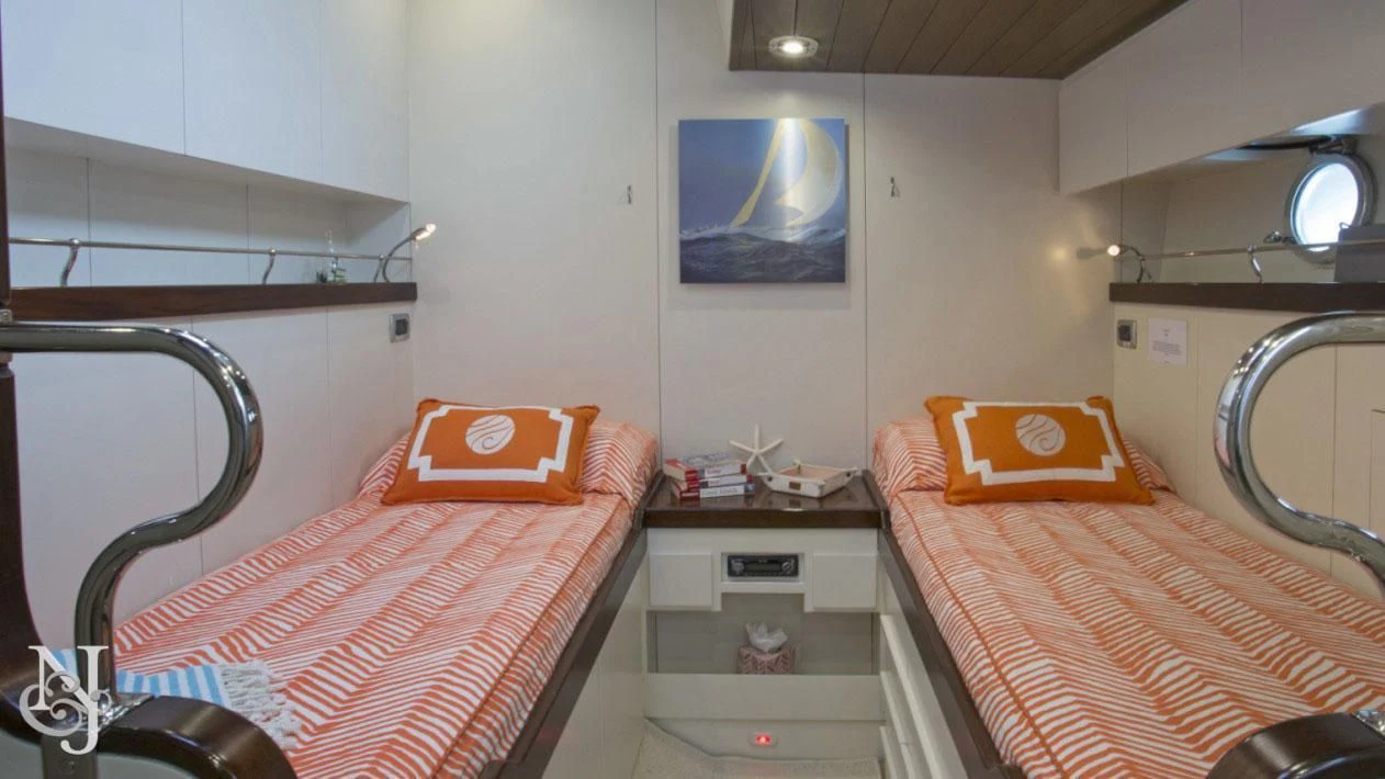 a couple of beds in a room aboard WISDOM Yacht for Sale