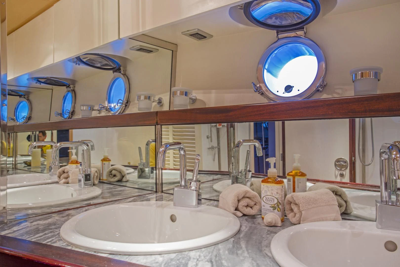a bathroom with sinks and mirrors aboard WISDOM Yacht for Sale