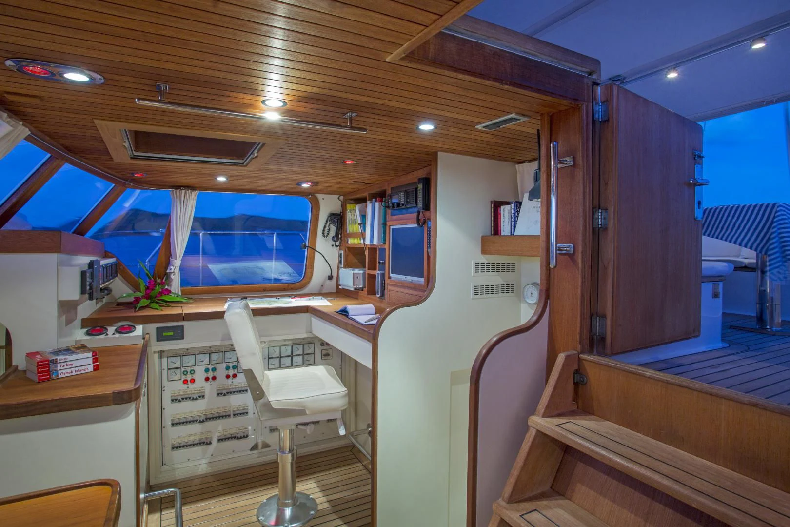 a room with bunk beds and a desk aboard WISDOM Yacht for Sale