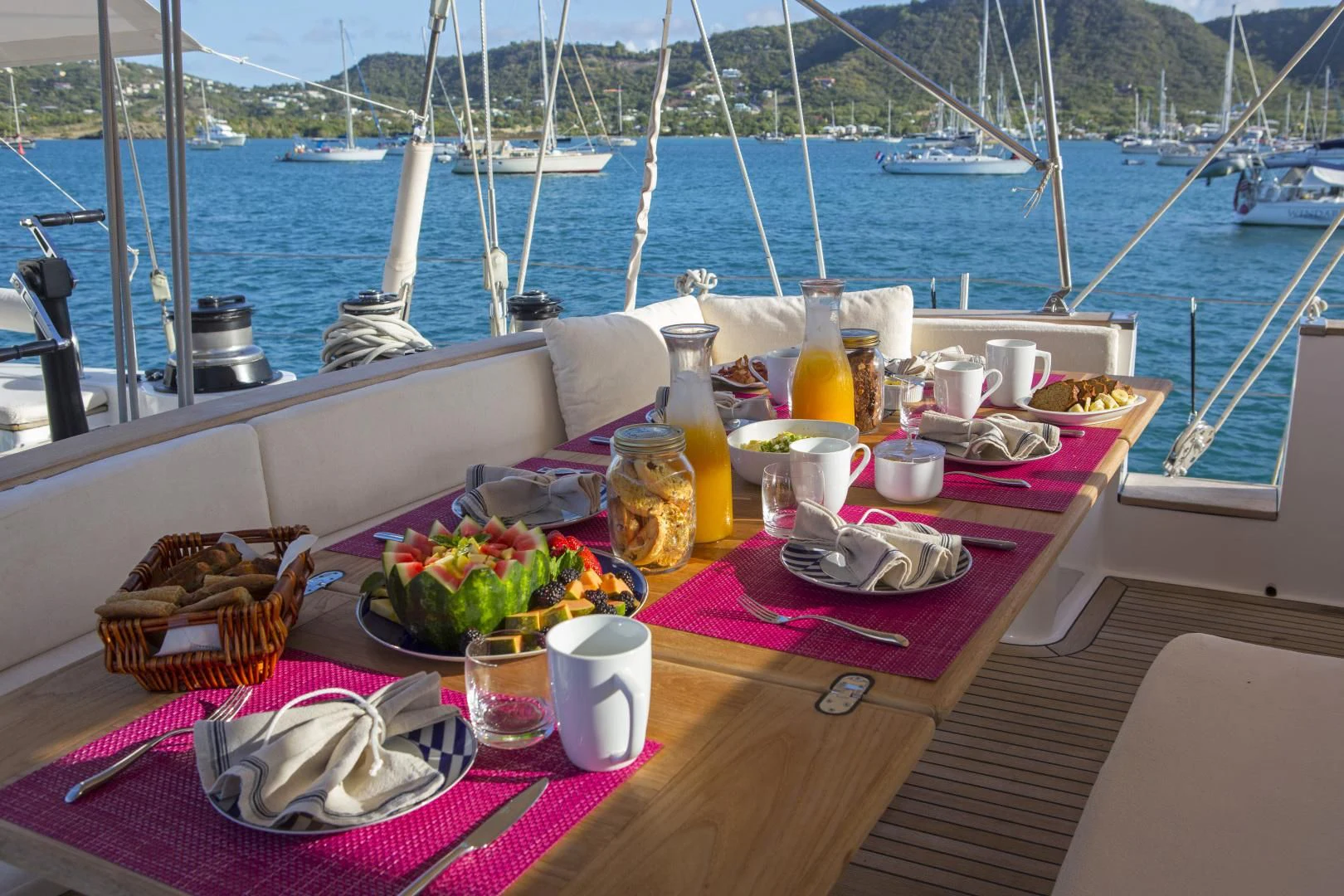 a table with food and drinks on it aboard WISDOM Yacht for Sale
