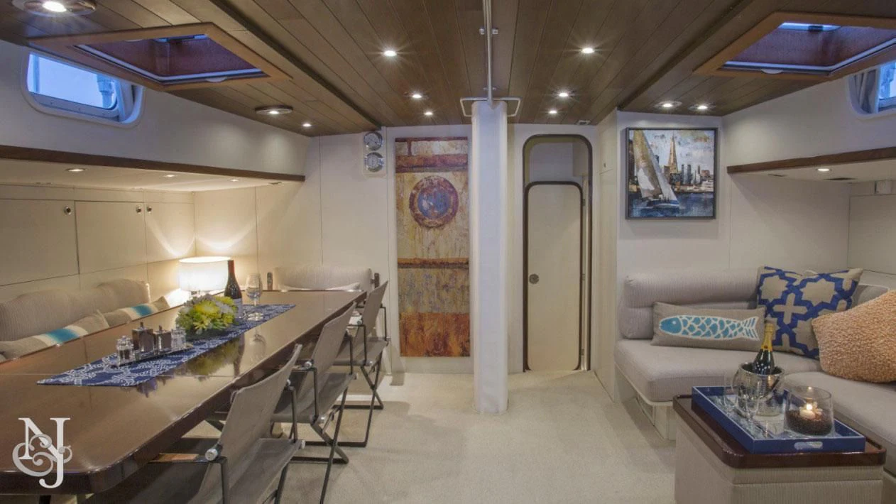 a room with a table and chairs aboard WISDOM Yacht for Sale