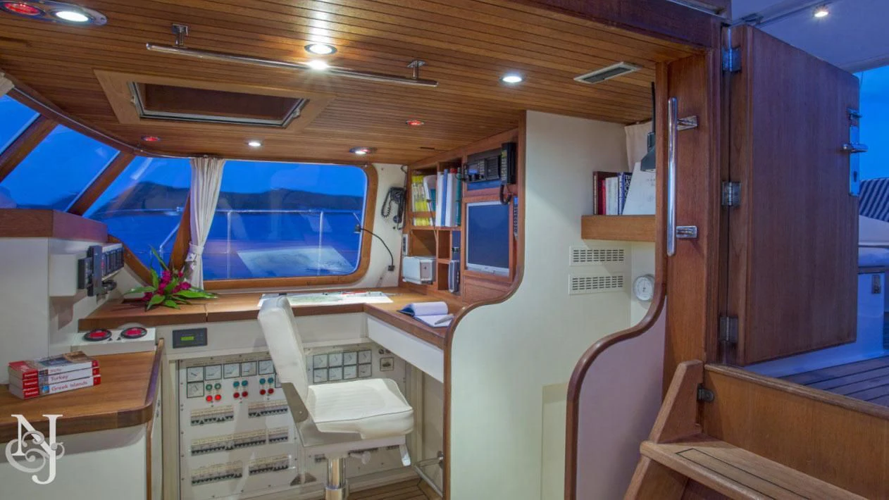 a room with a desk and a chair aboard WISDOM Yacht for Sale