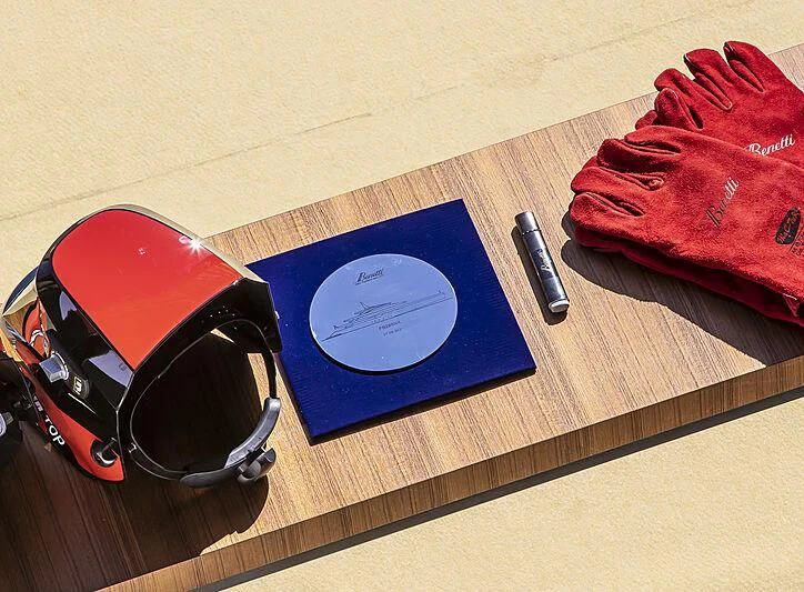 a blue book and headphones on a wooden surface aboard KASPER 7 Yacht for Sale