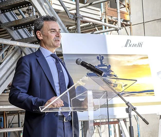 a man standing next to a large model of a plane aboard KASPER 7 Yacht for Sale