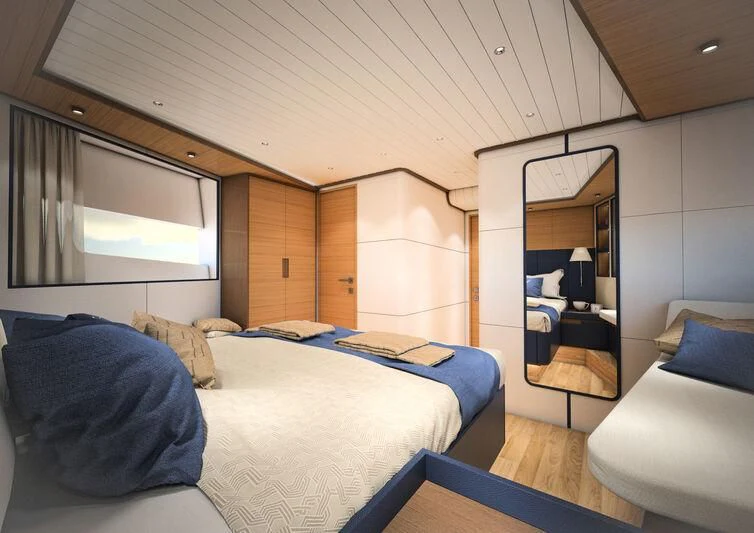 a room with a bed and a chair aboard GIPSY VI Yacht for Sale