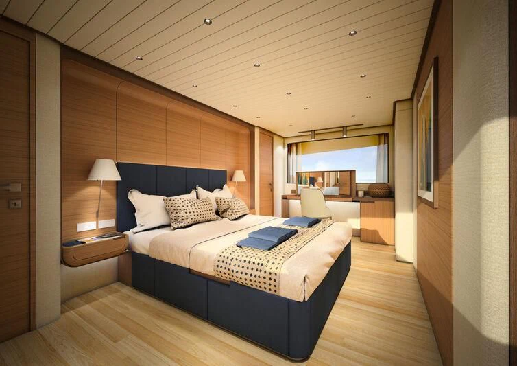 a bedroom with a large bed aboard GIPSY VI Yacht for Sale