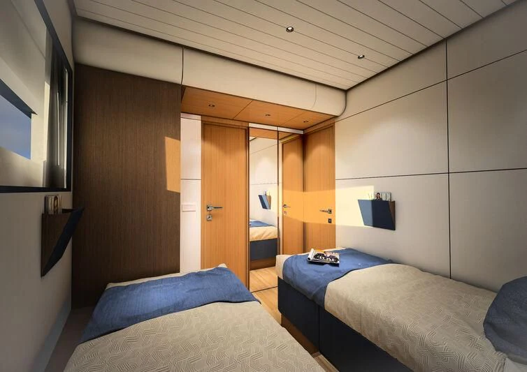 a room with a bed and a television aboard GIPSY VI Yacht for Sale