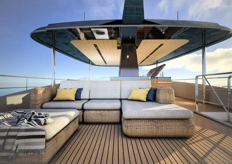 a large lounge chair with a large bed and a large white and black table with a large white aboard GIPSY VI Yacht for Sale