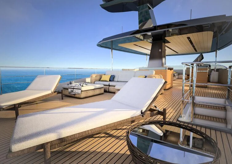 a deck with a view of the ocean and a boat aboard GIPSY VI Yacht for Sale