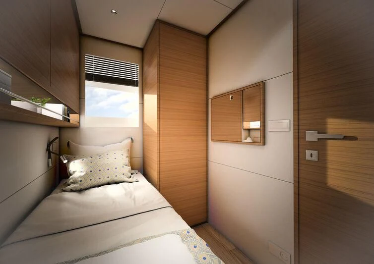 a bedroom with a bed and a wood door aboard GIPSY VI Yacht for Sale