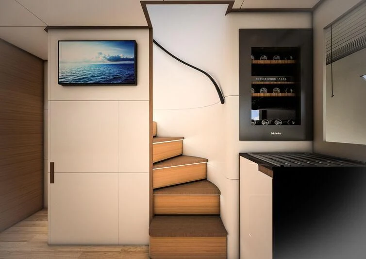 a room with a tv and a staircase aboard GIPSY VI Yacht for Sale