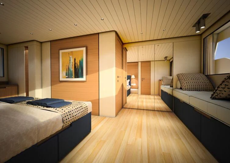 a room with a couple beds aboard GIPSY VI Yacht for Sale