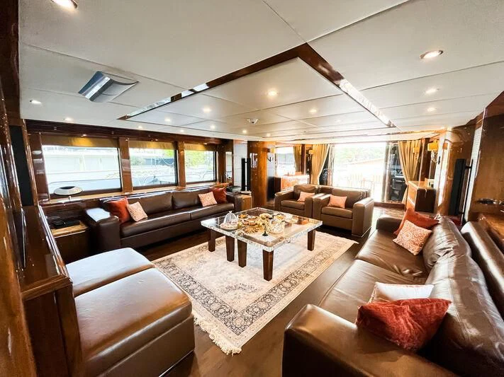 a living room with a large window aboard IMAN Yacht for Sale