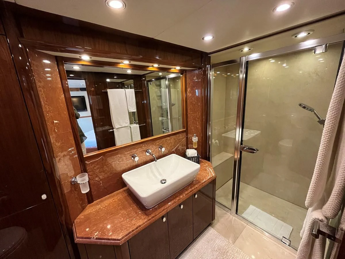 a bathroom with a sink and a mirror aboard IMAN Yacht for Sale