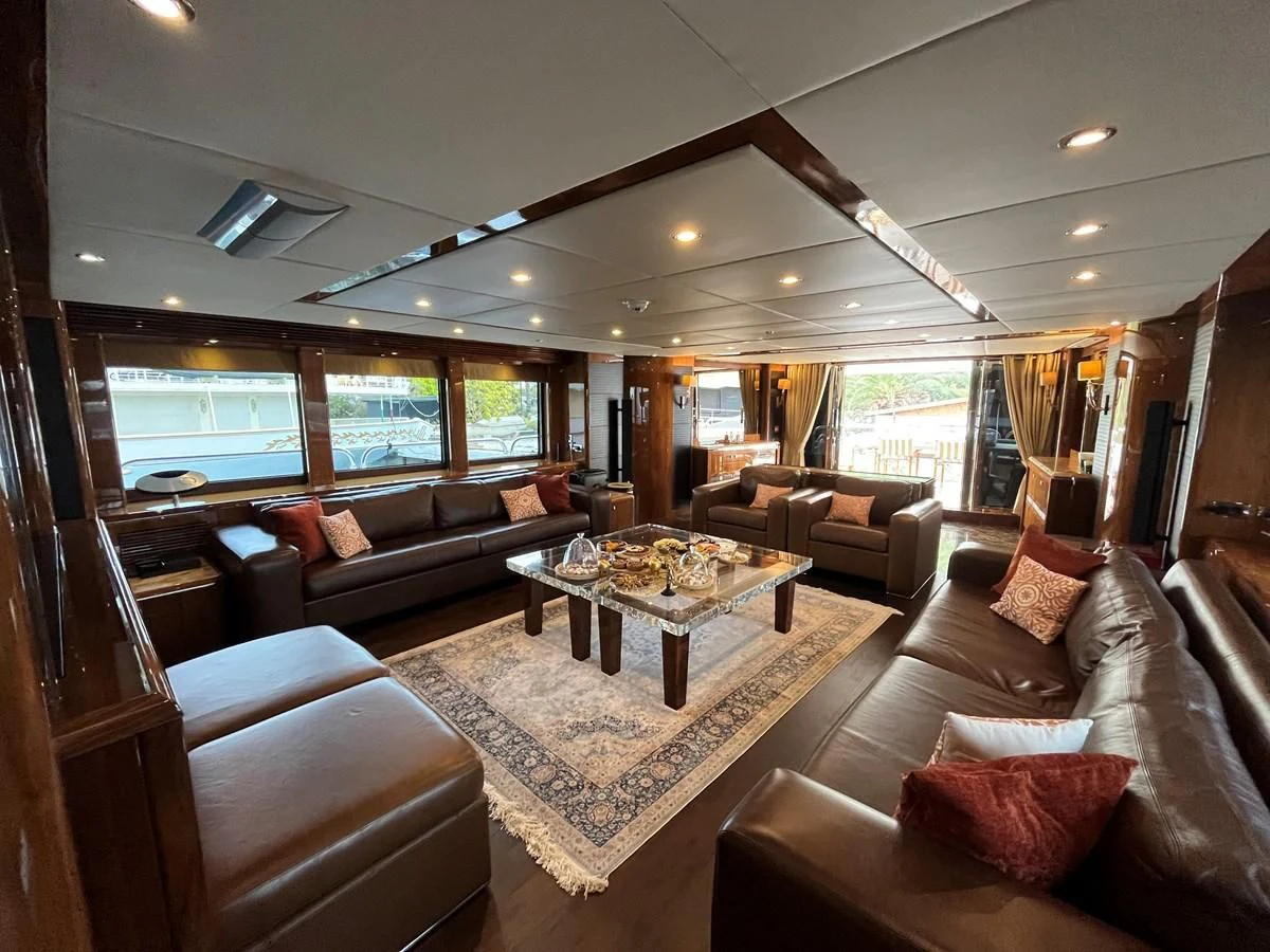 a living room with a large window aboard IMAN Yacht for Sale