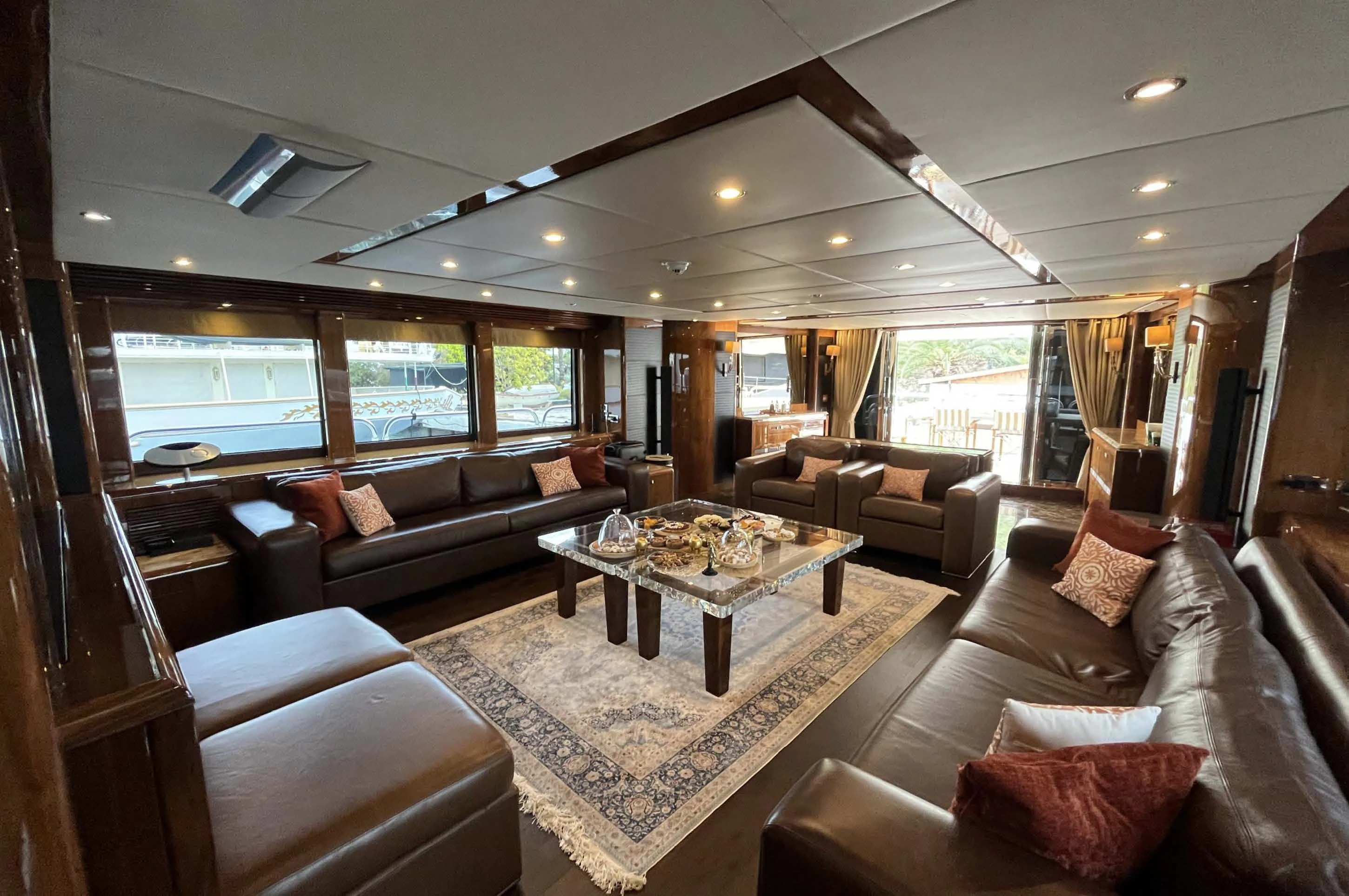 a living room with a large window aboard IMAN Yacht for Sale