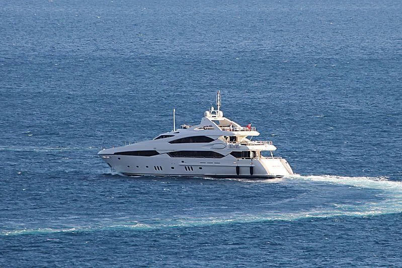 a white yacht in the ocean aboard IMAN Yacht for Sale
