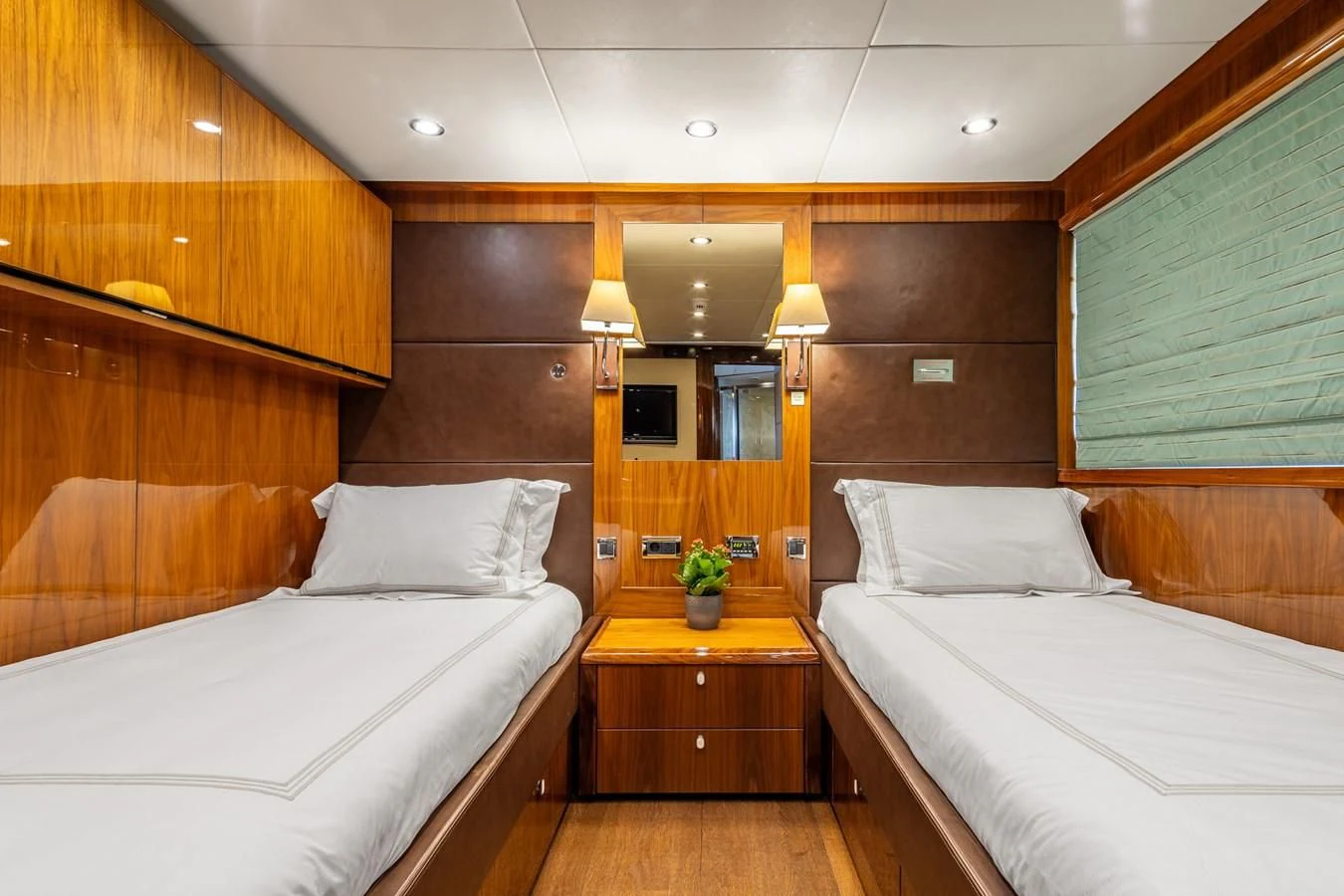 a room with two beds aboard IMAN Yacht for Sale