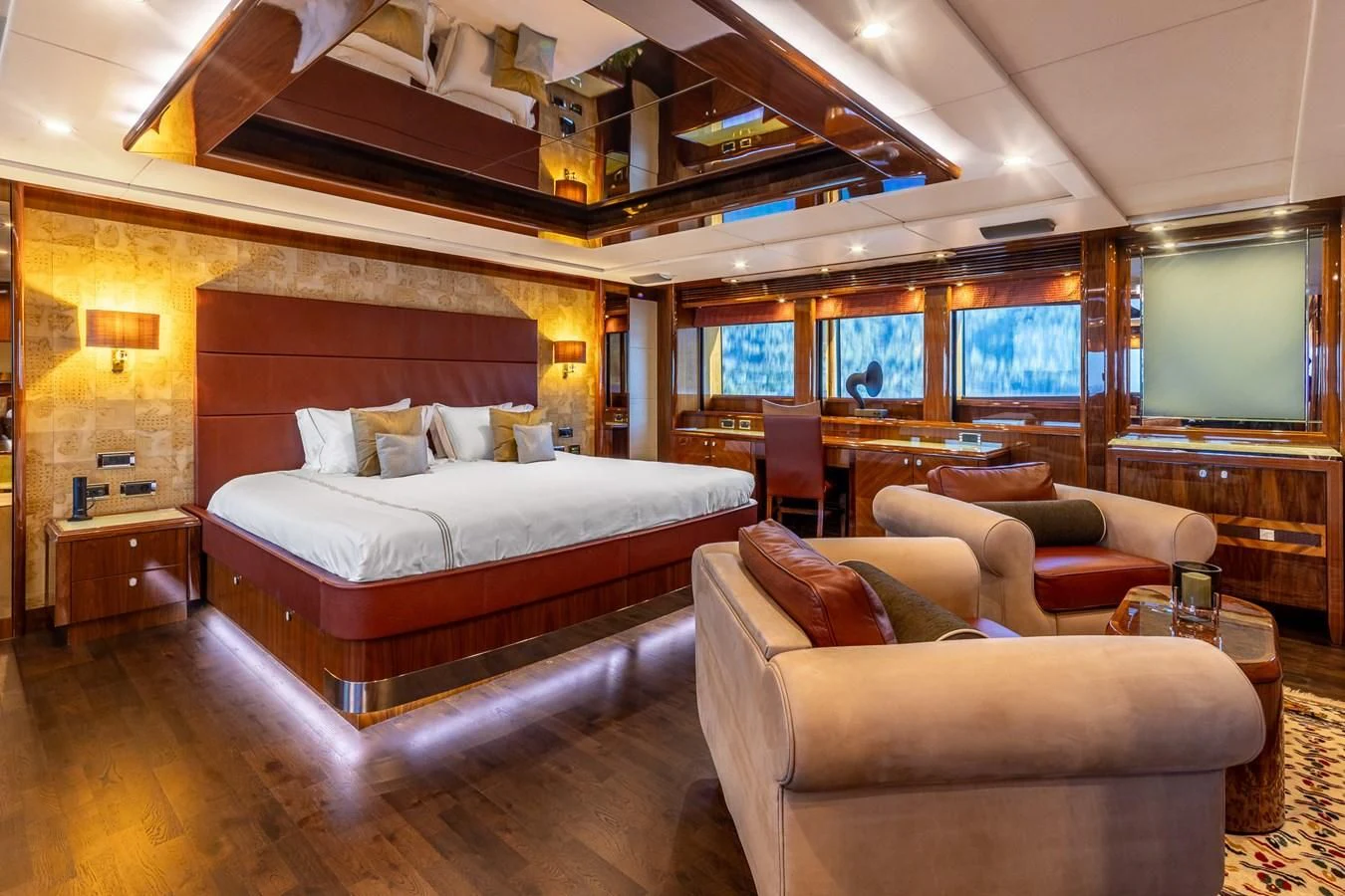 a bedroom with a bed and a couch aboard IMAN Yacht for Sale