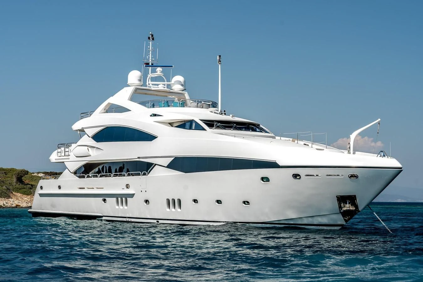 a white yacht on the water aboard IMAN Yacht for Sale