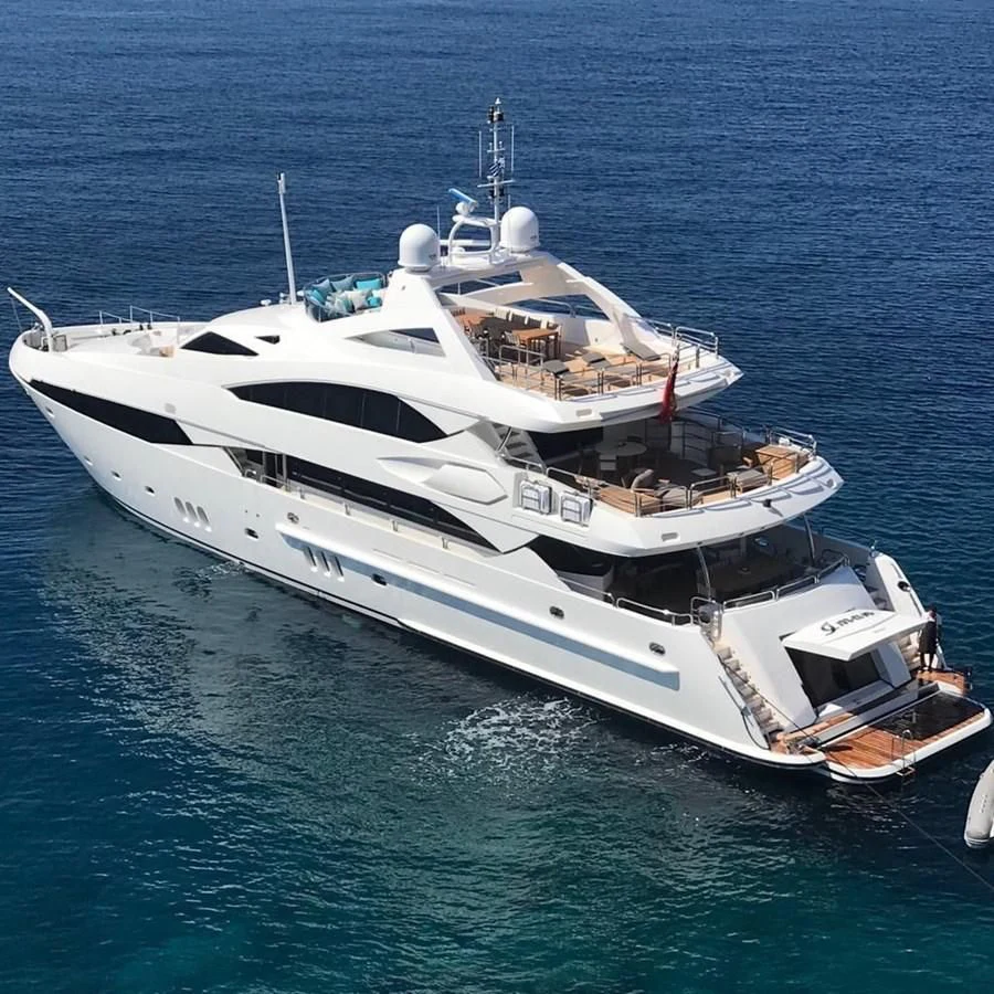 a white yacht in the water aboard IMAN Yacht for Sale