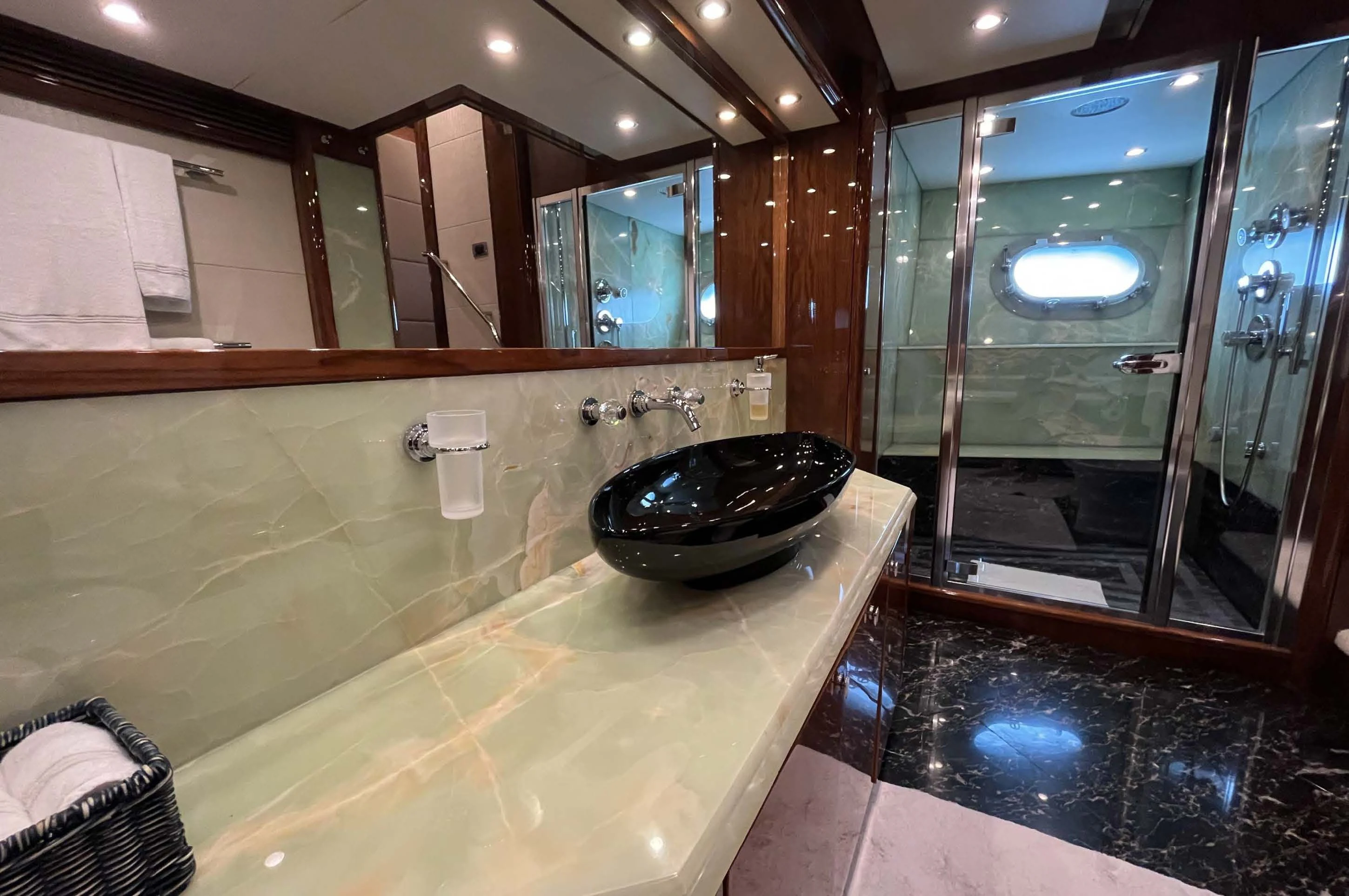 a bathroom with a large marble counter aboard IMAN Yacht for Sale