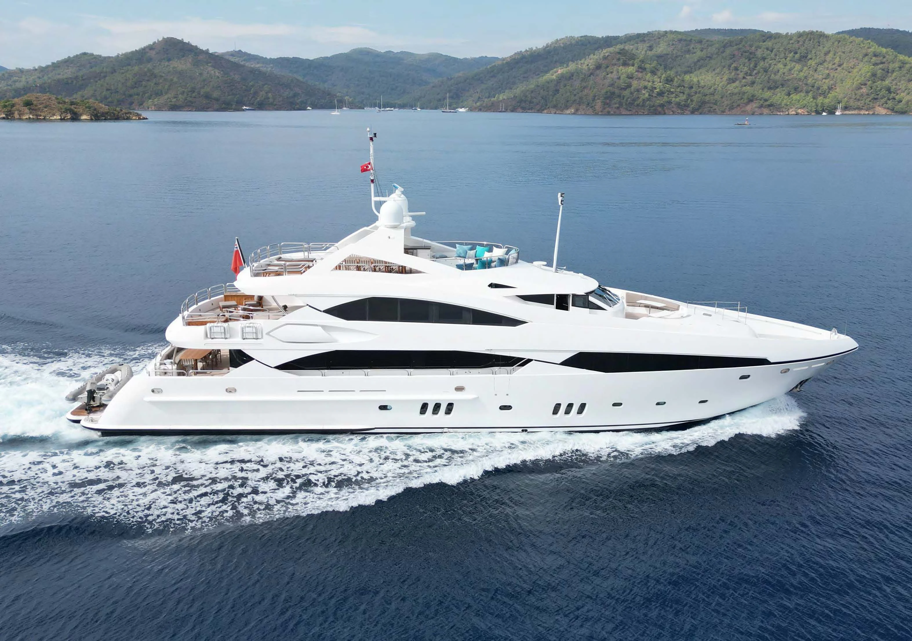 a white yacht on the water aboard IMAN Yacht for Sale