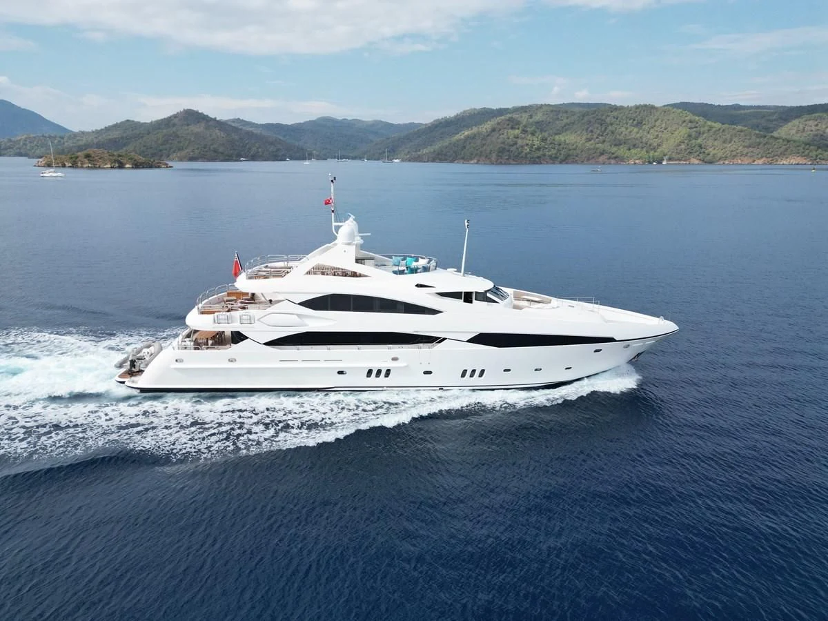 a white yacht on the water aboard IMAN Yacht for Sale