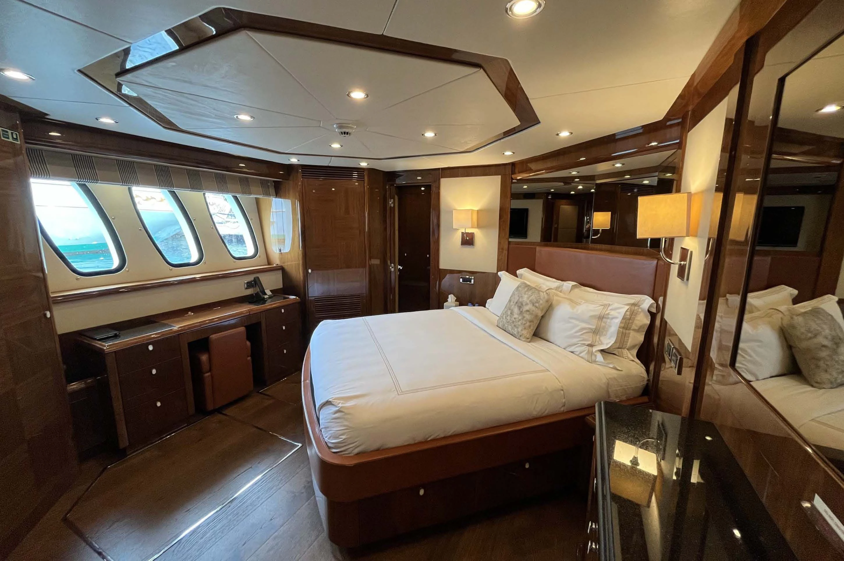 a room with a bed and a desk aboard IMAN Yacht for Sale