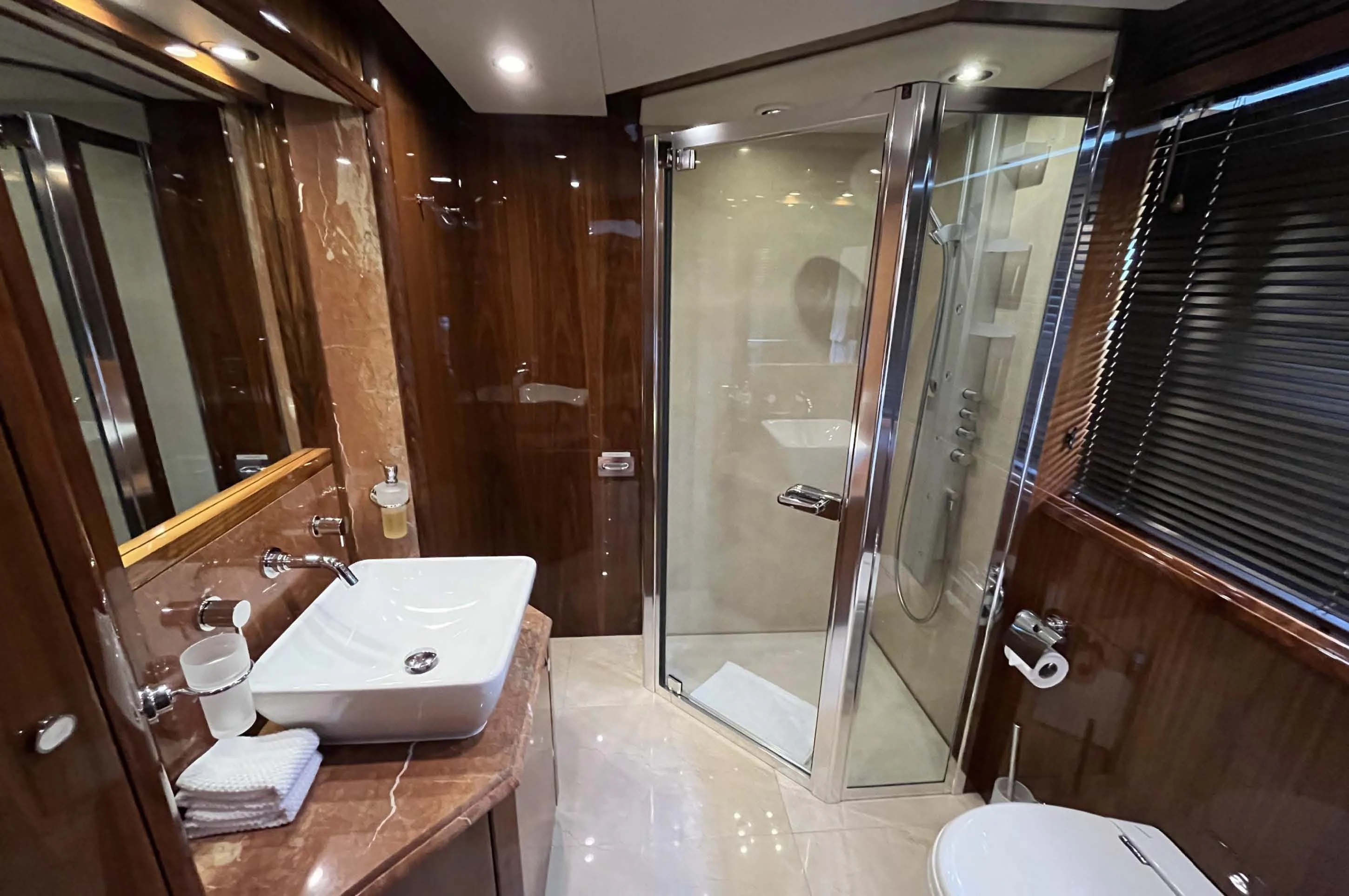 a bathroom with a large shower aboard IMAN Yacht for Sale