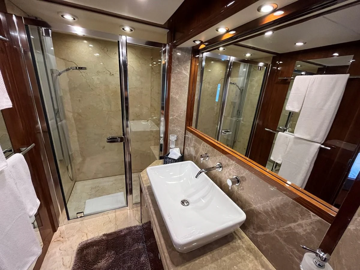 a bathroom with a large tub aboard IMAN Yacht for Sale