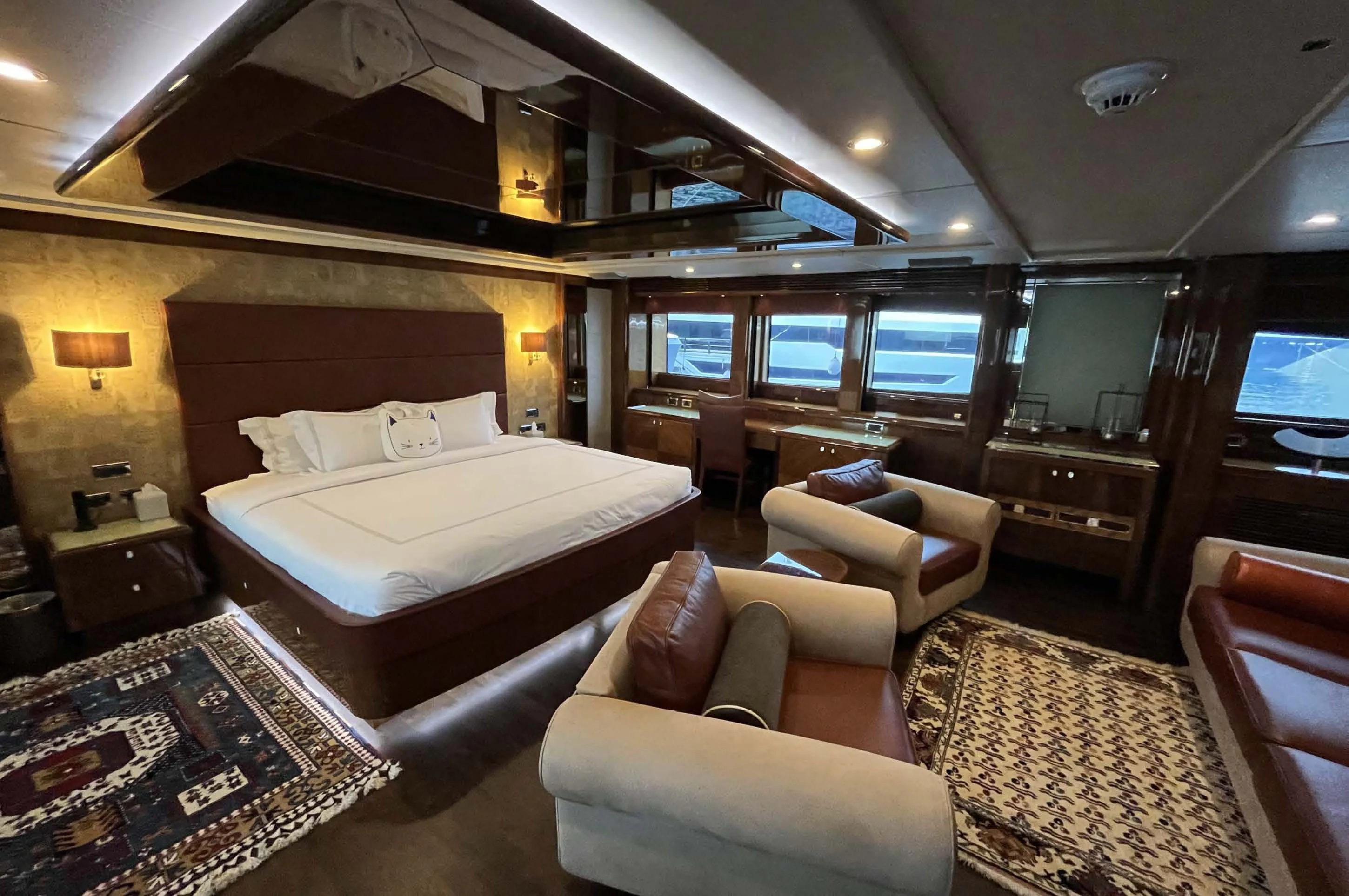a large hotel room with a bed and a couch aboard IMAN Yacht for Sale