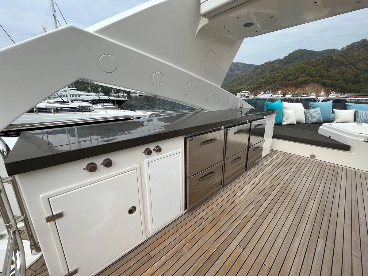 a large white kitchen with a large deck and a pool aboard IMAN Yacht for Sale