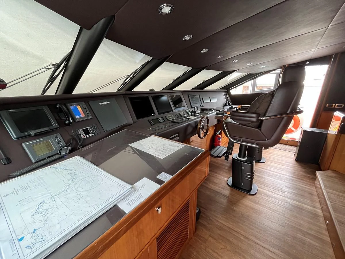 a room with a desk and computer aboard IMAN Yacht for Sale