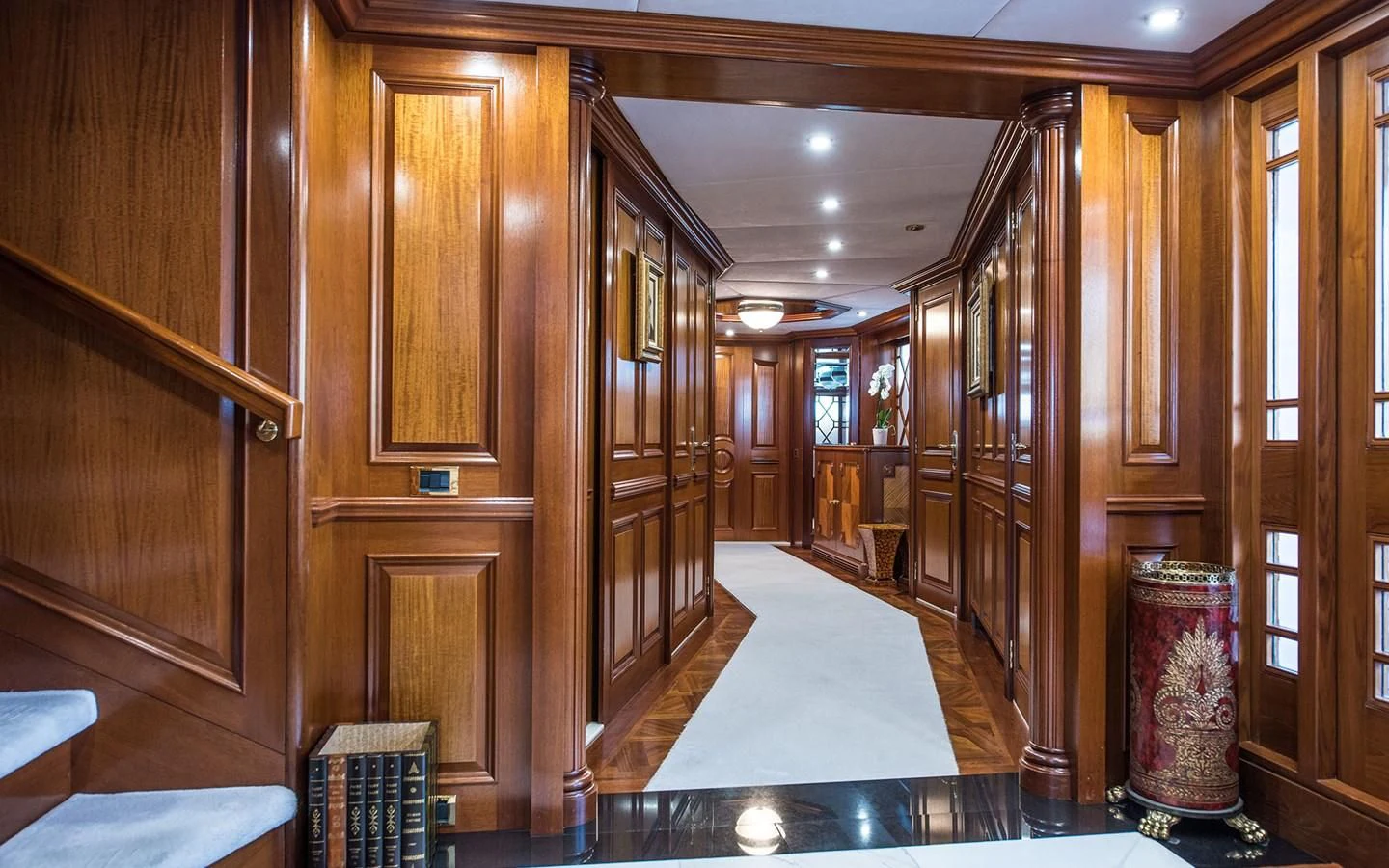 a large room with wooden cabinets aboard BLUE STAR Yacht for Sale