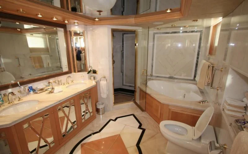 a bathroom with a tub sink and a toilet aboard BLUE STAR Yacht for Sale
