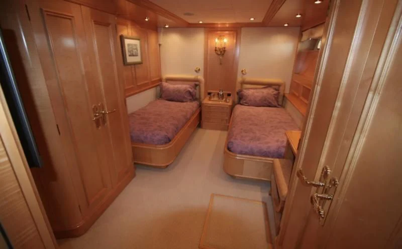 a room with a bed and a couch aboard BLUE STAR Yacht for Sale
