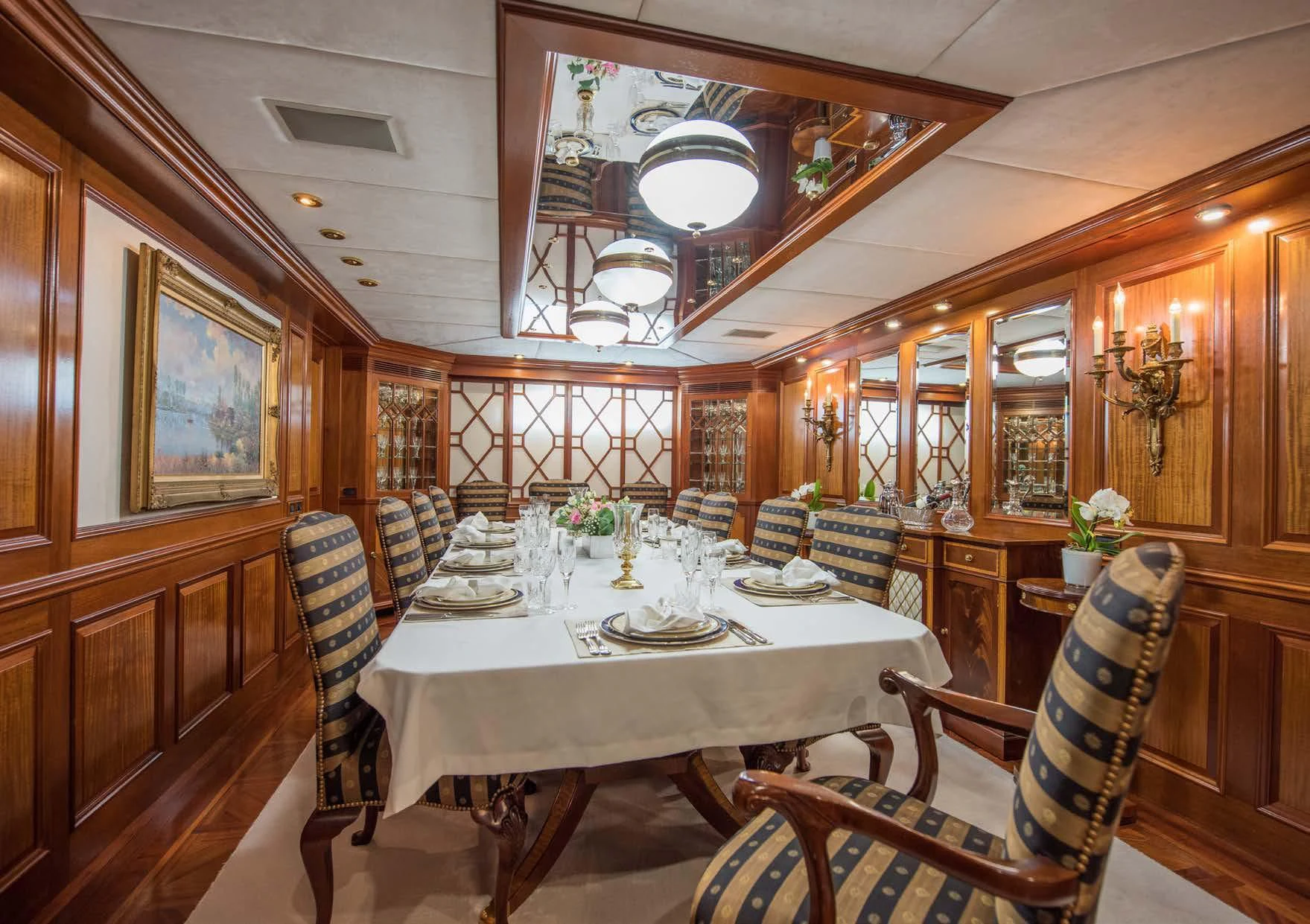 a dining room with a table and chairs aboard BLUE STAR Yacht for Sale