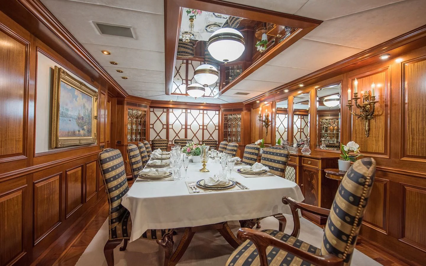 a dining room with a table aboard BLUE STAR Yacht for Sale