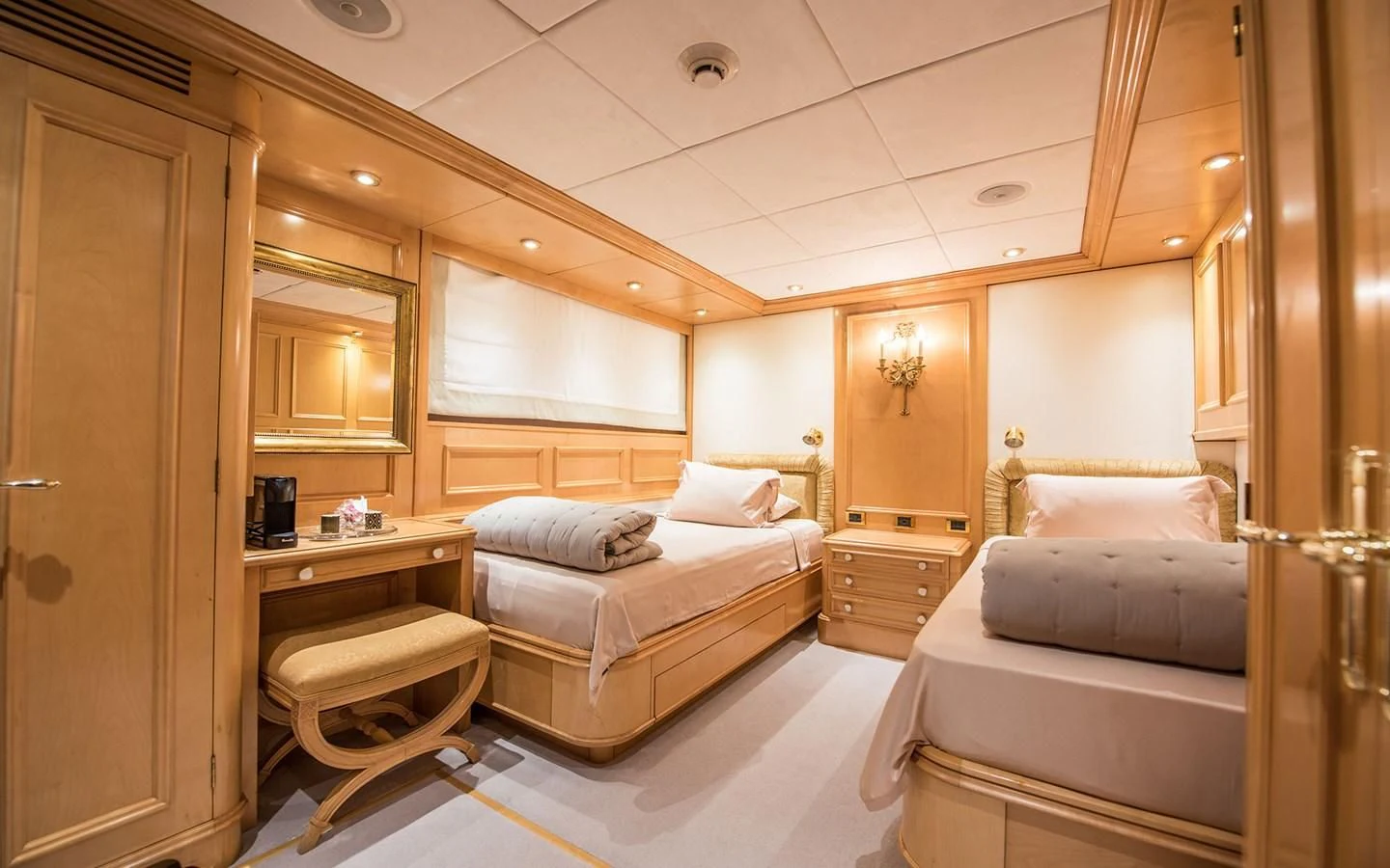 a room with a bed and a desk aboard BLUE STAR Yacht for Sale