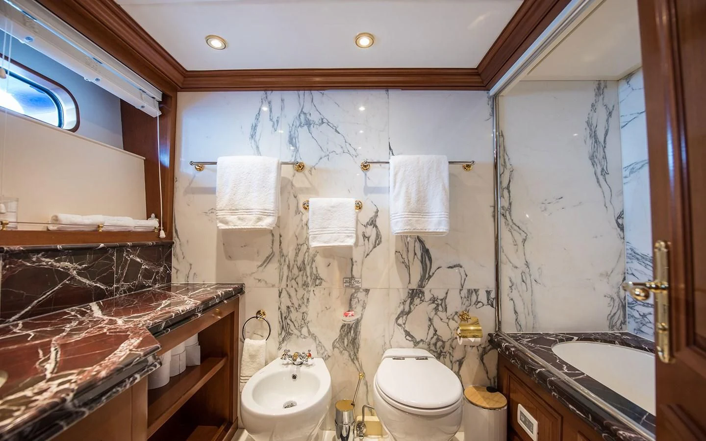 a bathroom with a sink toilet and a bathtub aboard BLUE STAR Yacht for Sale