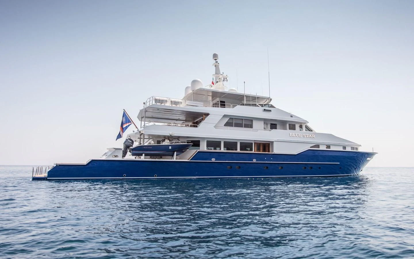 a large boat in the water aboard BLUE STAR Yacht for Sale