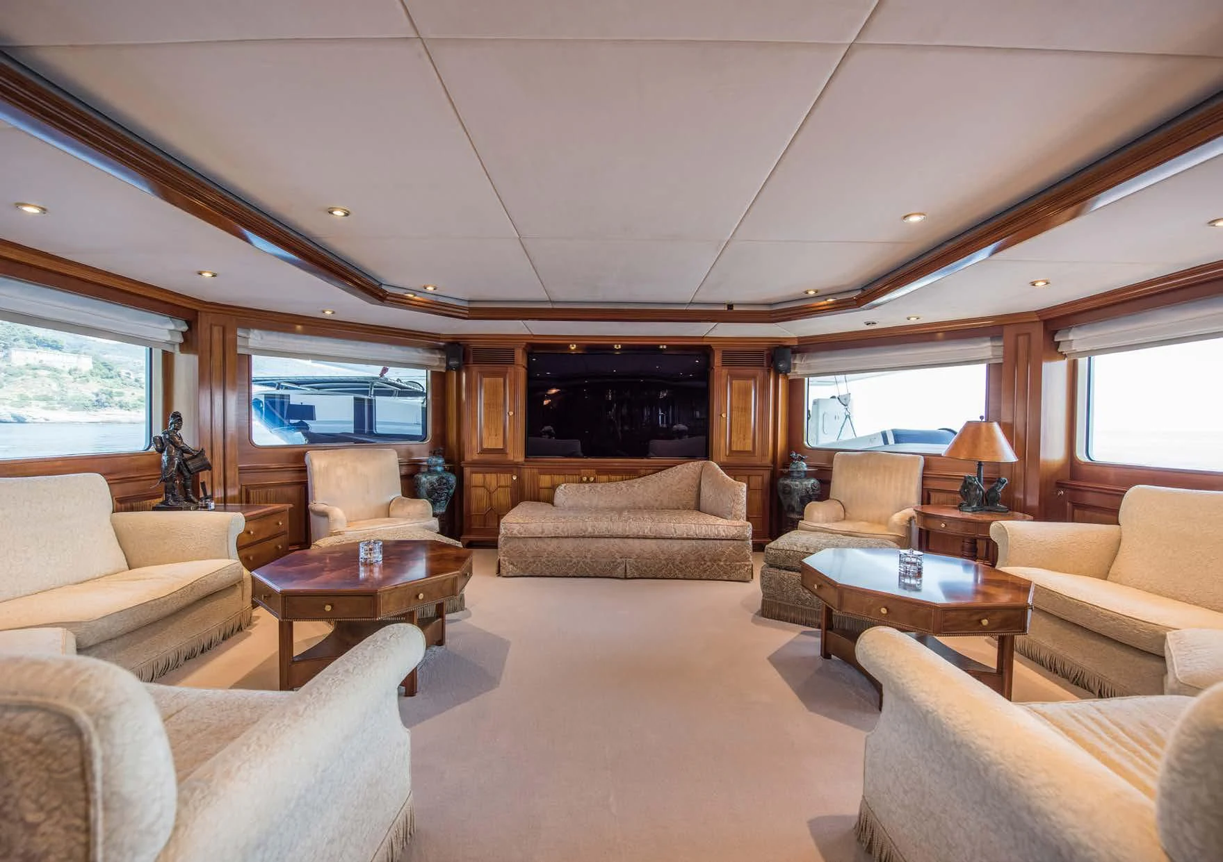 a living room with a fireplace aboard BLUE STAR Yacht for Sale