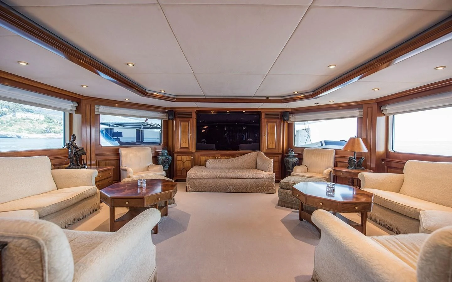a living room with a fireplace aboard BLUE STAR Yacht for Sale