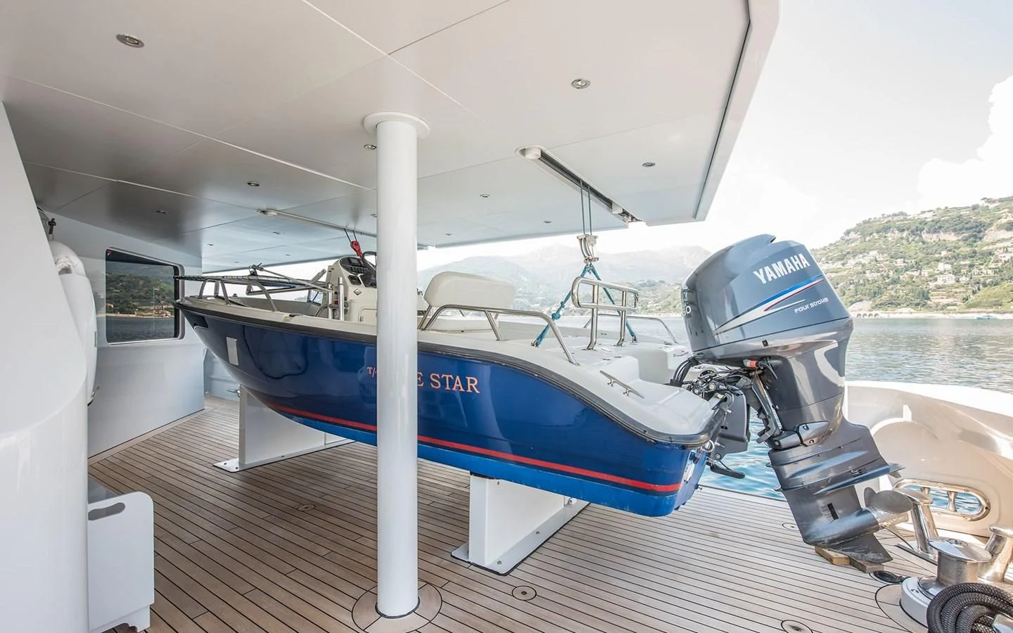a boat on a deck aboard BLUE STAR Yacht for Sale
