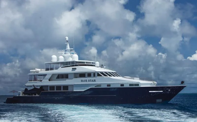 a large white boat in the water aboard BLUE STAR Yacht for Sale