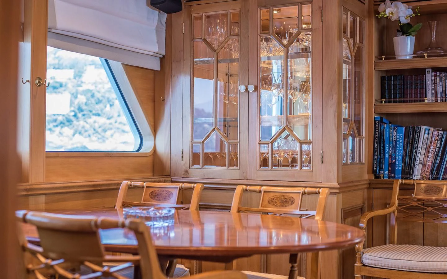 a room with a table and chairs aboard BLUE STAR Yacht for Sale